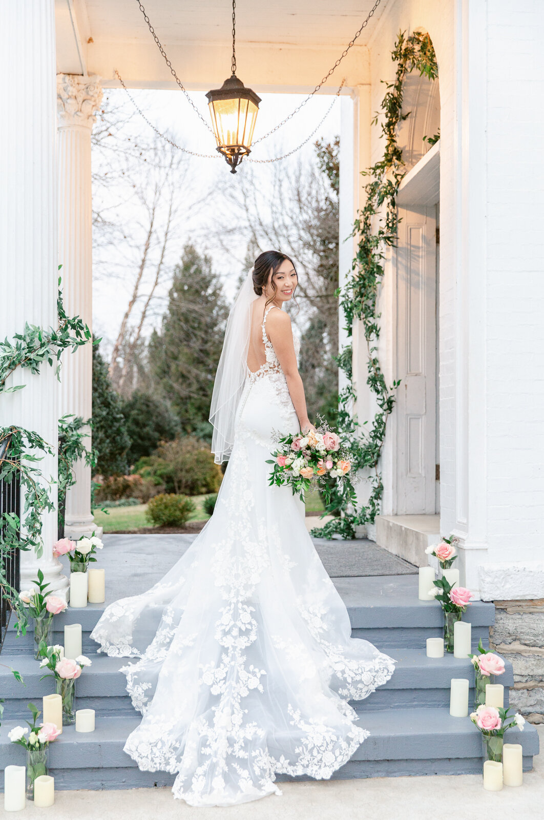 Gorgeous bridal Portrait on the front steps of Ceresville Mansion in Frederick Maryland. Captured by Bethany Aubre Photography.
