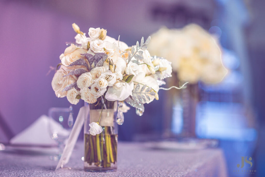 White and silver wedding centerpieces.