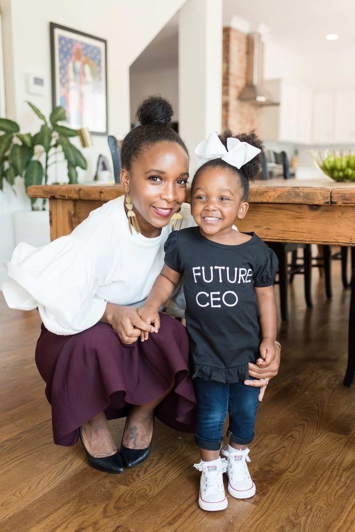 black business owner with her daughter who is wearing a "future ceo" shirt in Nashville