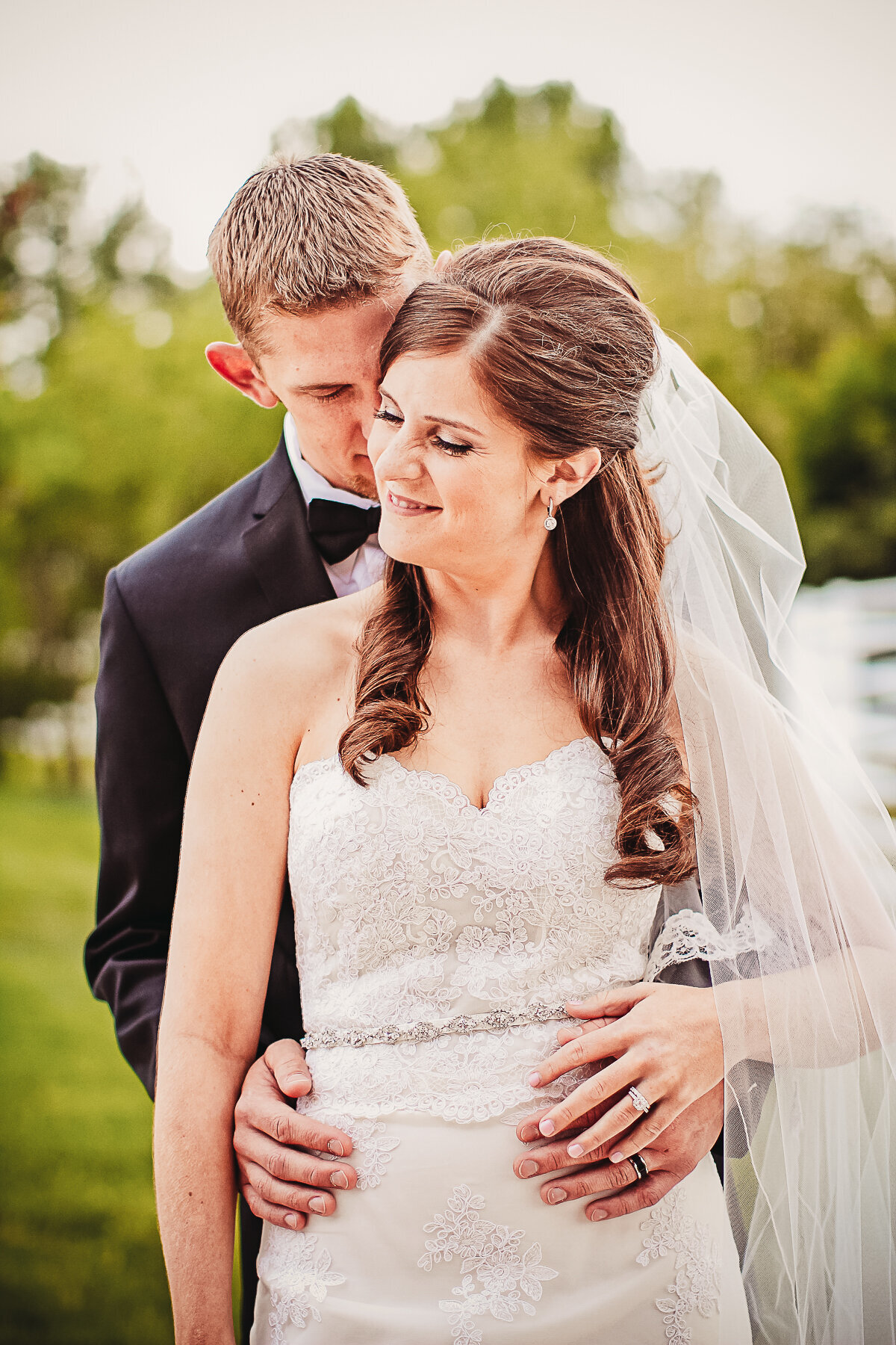 Bride and Groom embrace at Crooked Willow Farms