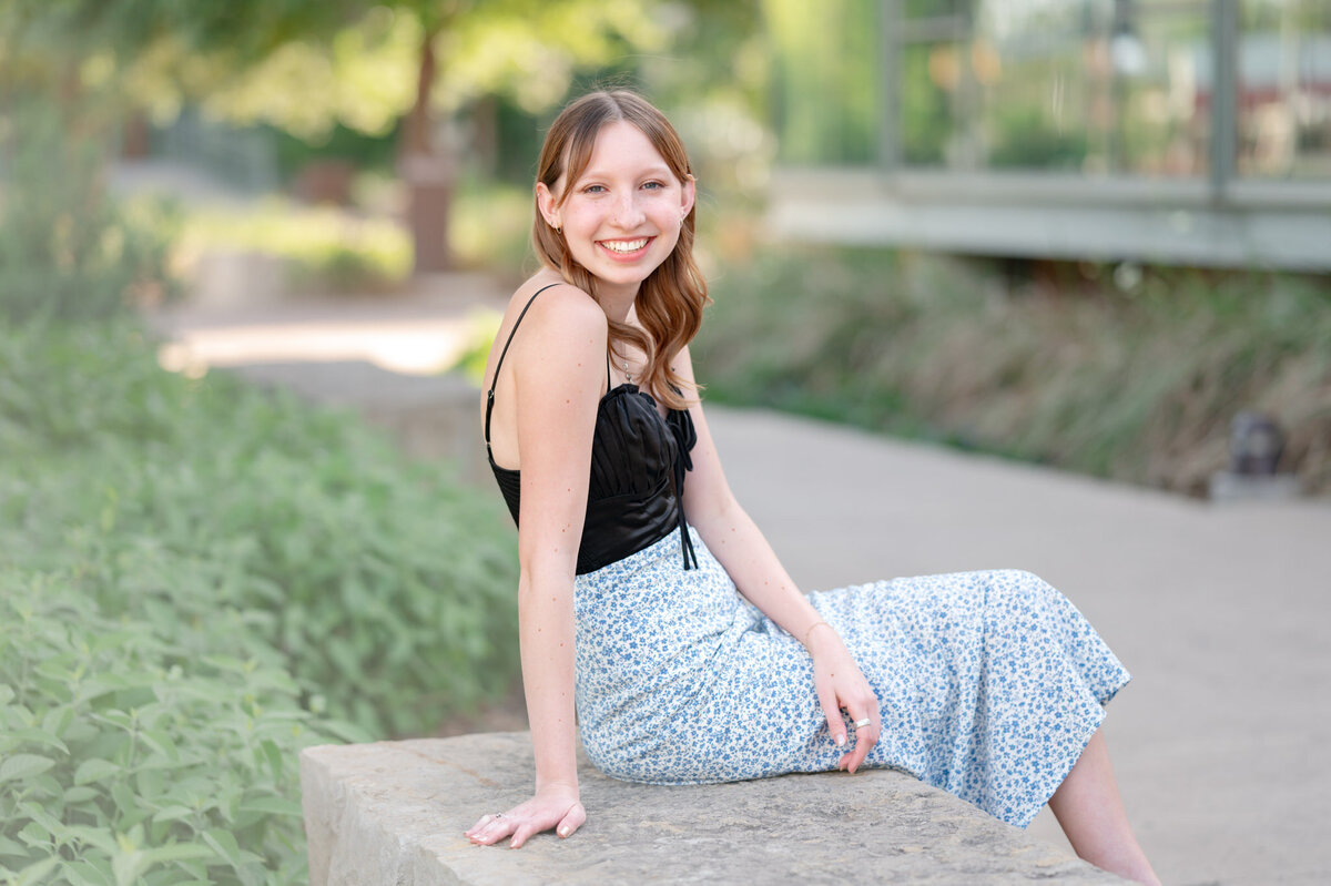San Antonio senior poses for pictures on a bench at the Witte.