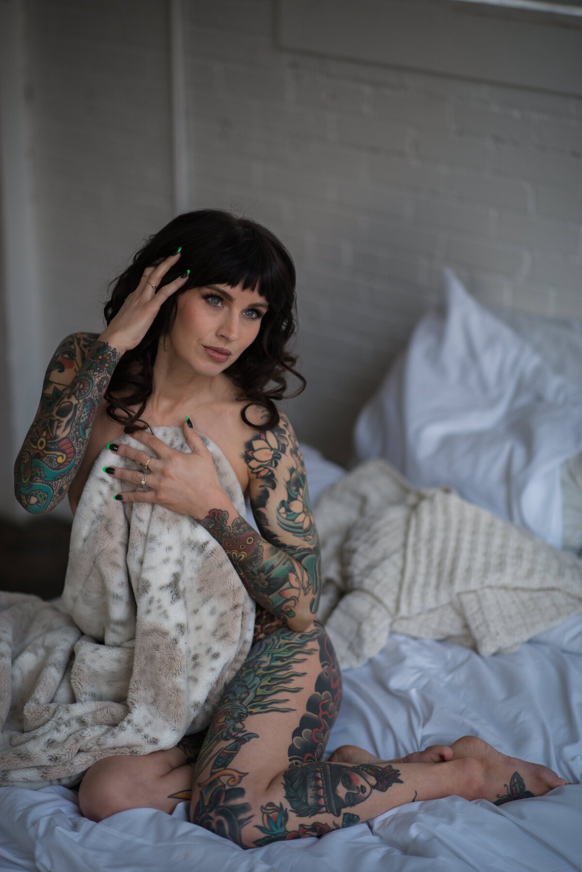 Artistic tattoo boudoir capturing unique body art and personal expression.