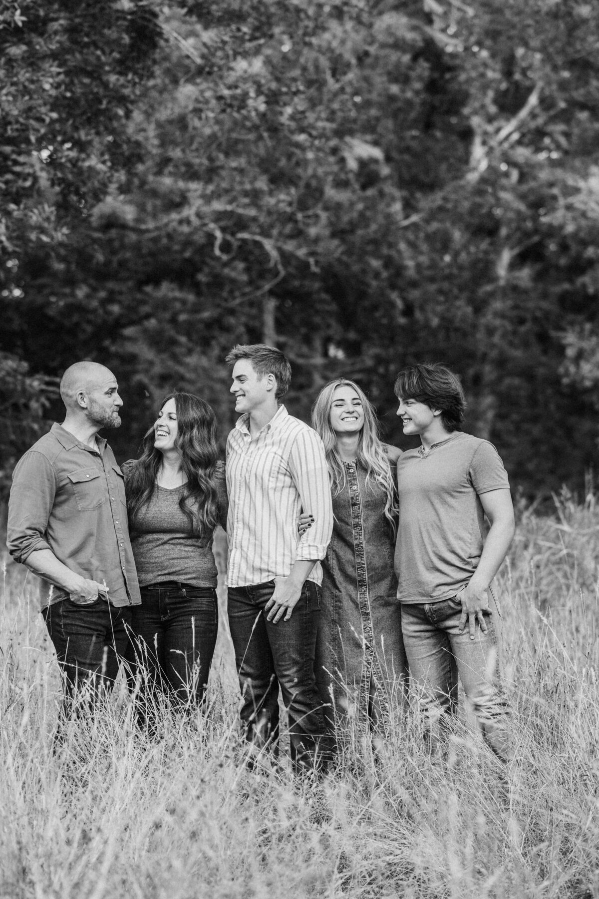 family-laughs-with-older-kids