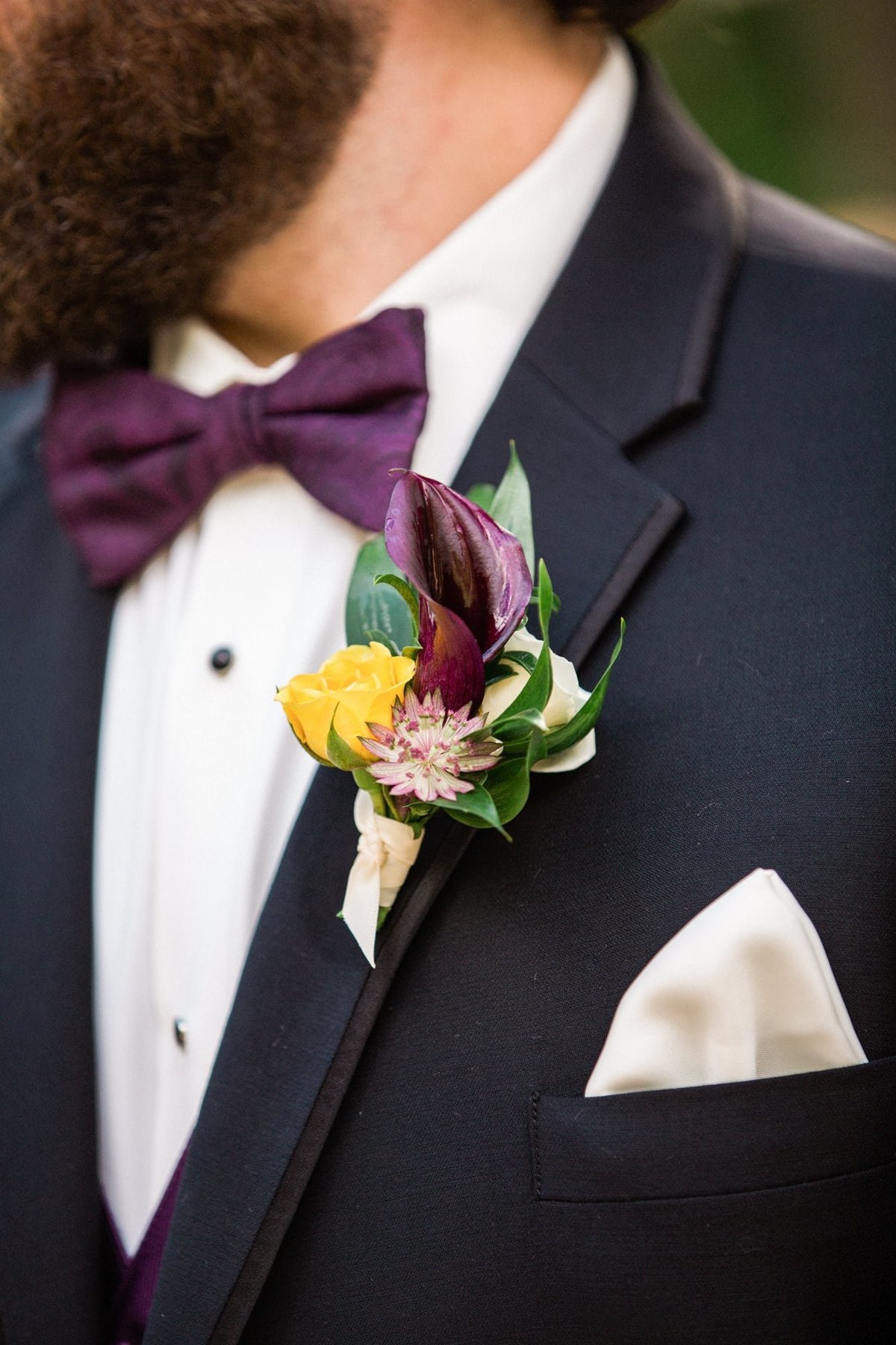 Groom's boutonniere on his lapel before the wedding ceremony