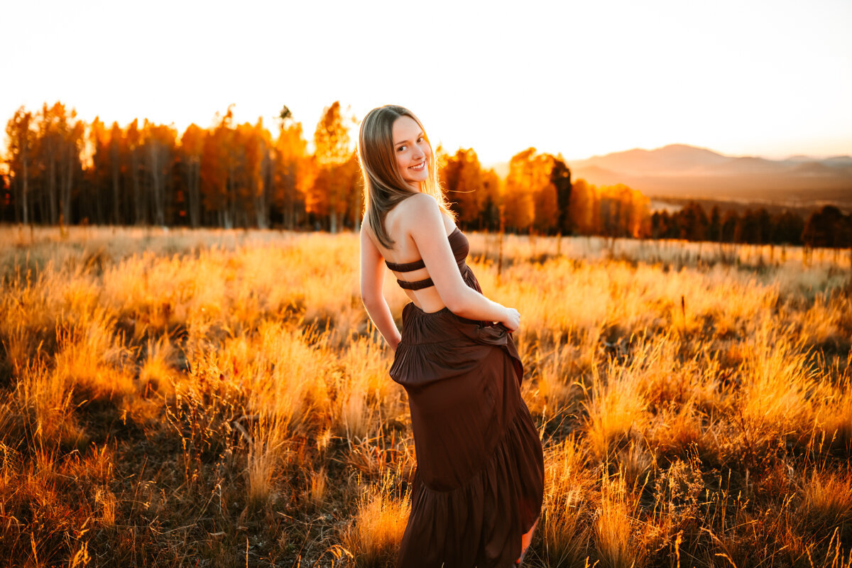 Arizona snowbowl at sunset with a girl swaying her maxi dress by annie bee photography.
