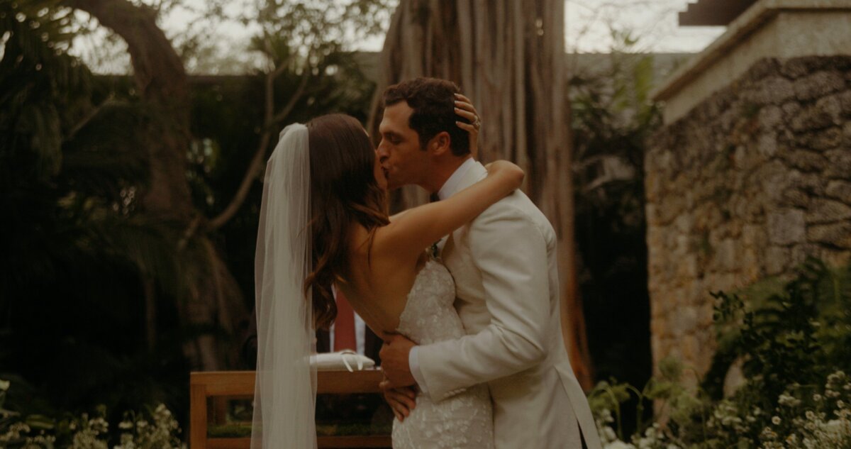 bride and groom kiss