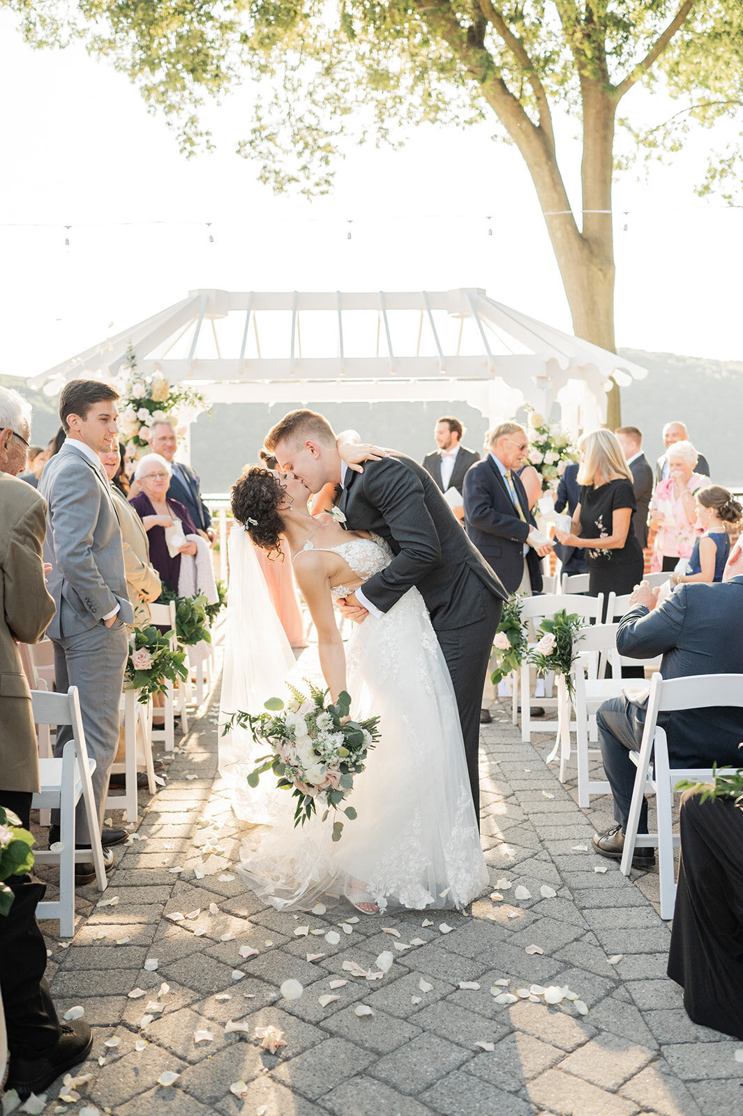dramatic kiss as couple exits from grandview wedding ceremony