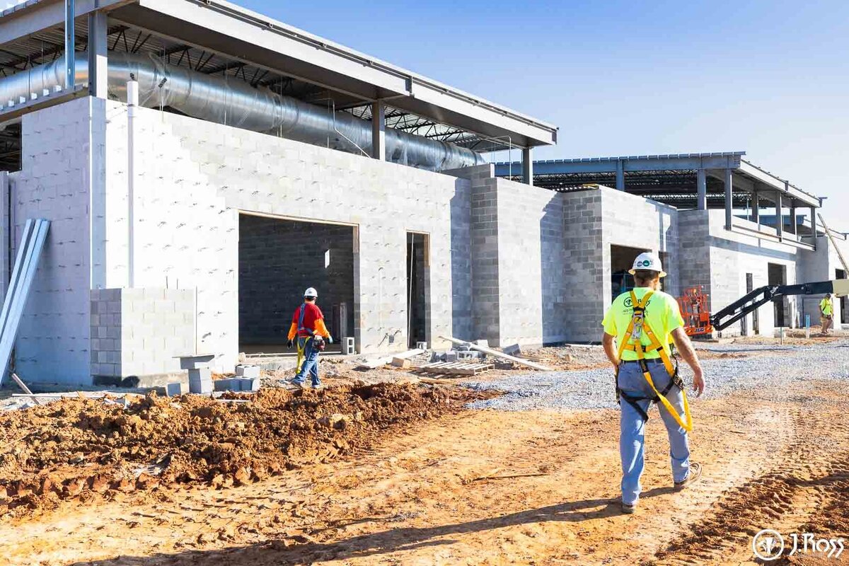 J.Ross Painting & Drywall crew members on the TCAT construction site, wearing safety harnesses while working on the new higher education building in Greeneville, TN.