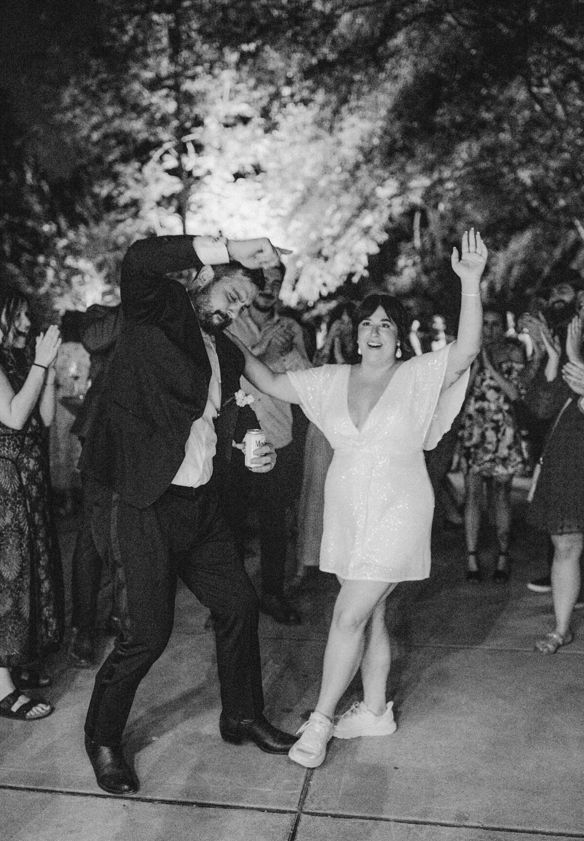 Bride and groom dancing at wedding reception at Umlauf Sculpture Garden, Austin