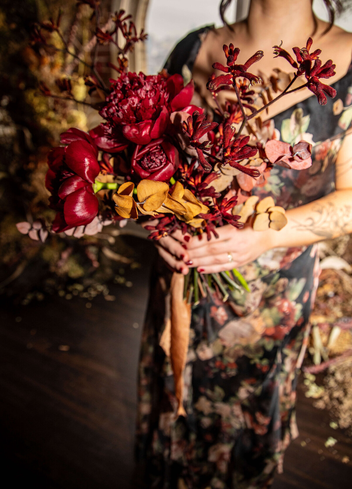 Red roses and dried flower bridal bouquet by Jessamine