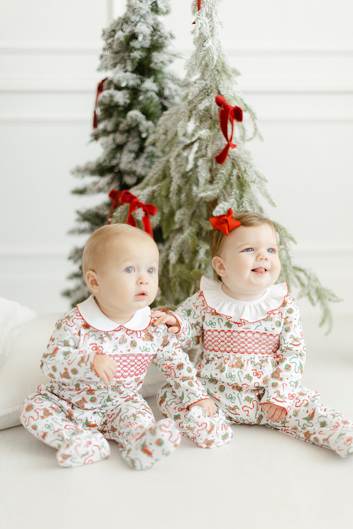 Professional branding photo of 2 babies modeling Dondolo christmas clothing