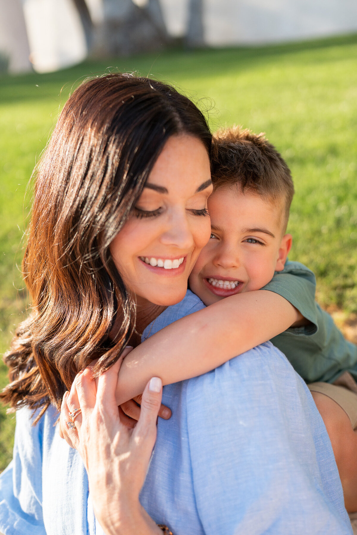 Mom and son snuggle during a sunset session with a Palm Springs Photographer session