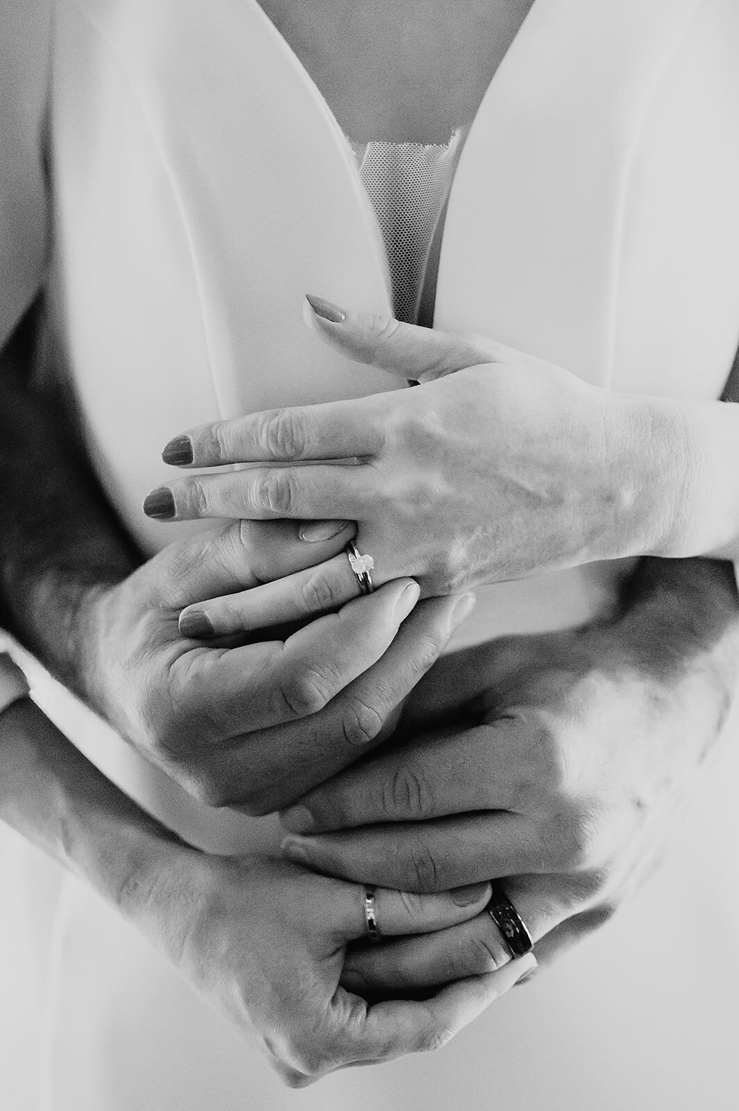 Bride and groom put on eacother rings at an intimate Norther Minnesota wedding