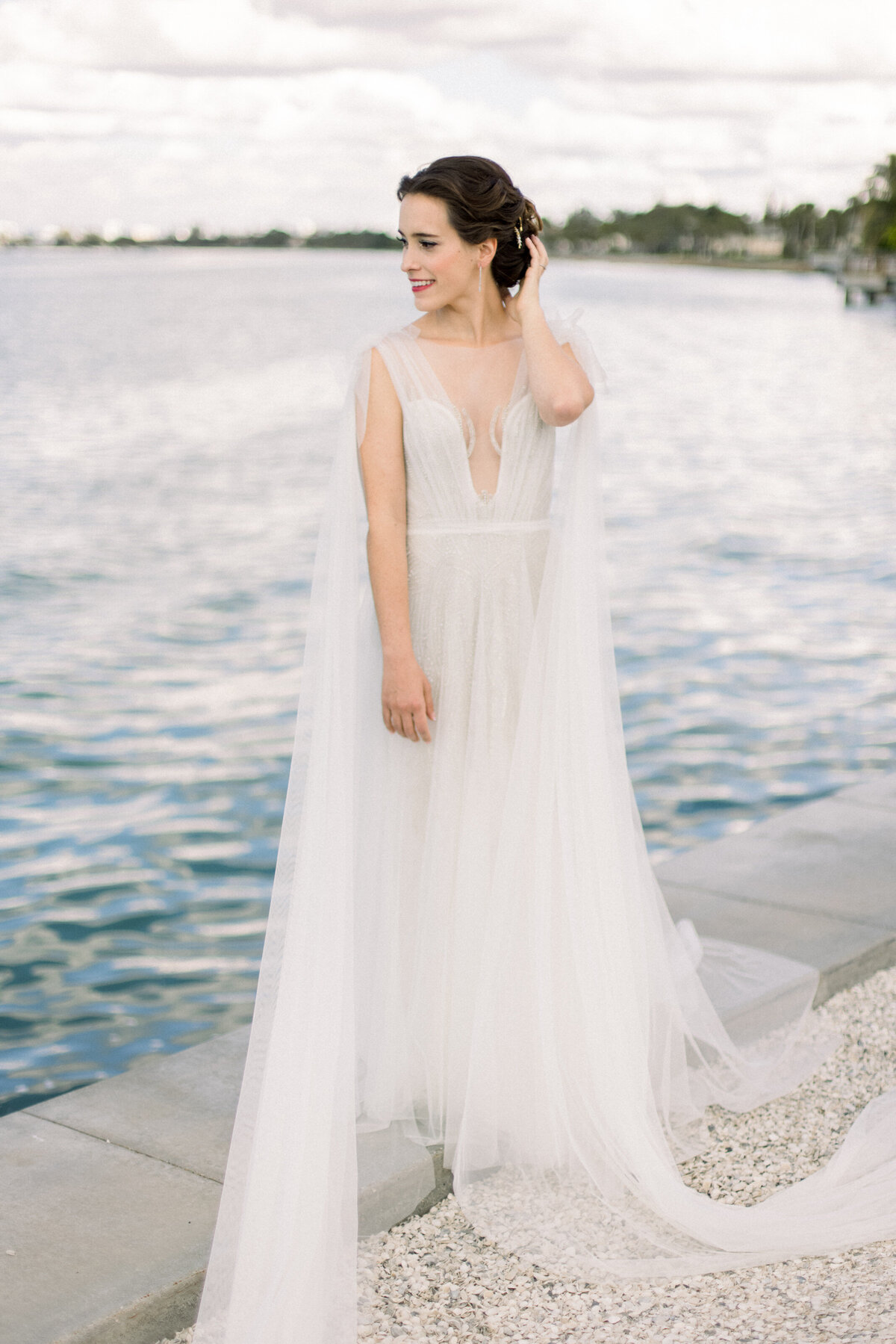 A bride on the coastline at her Sarasota Ritz Carlton Wedding
