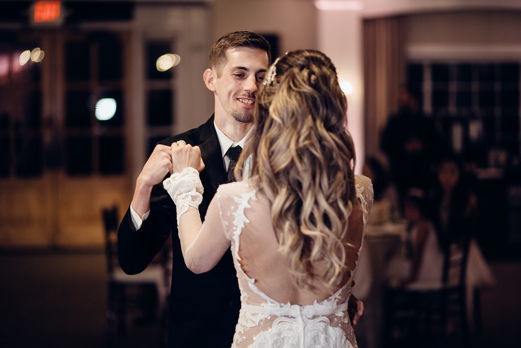 Wedding Photograph Of Groom Smiling While Dancing With His Bride Los Angeles
