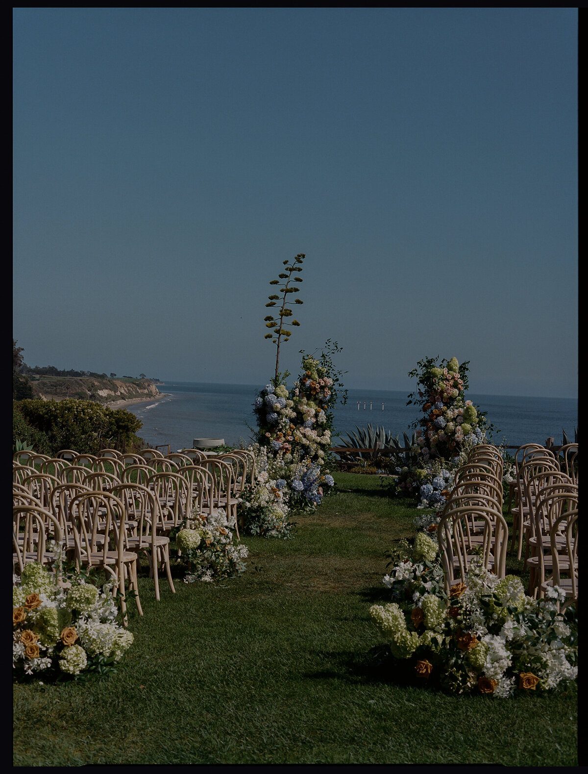 lush coastal ceremony design for exclusive destination wedding and event in montecito california