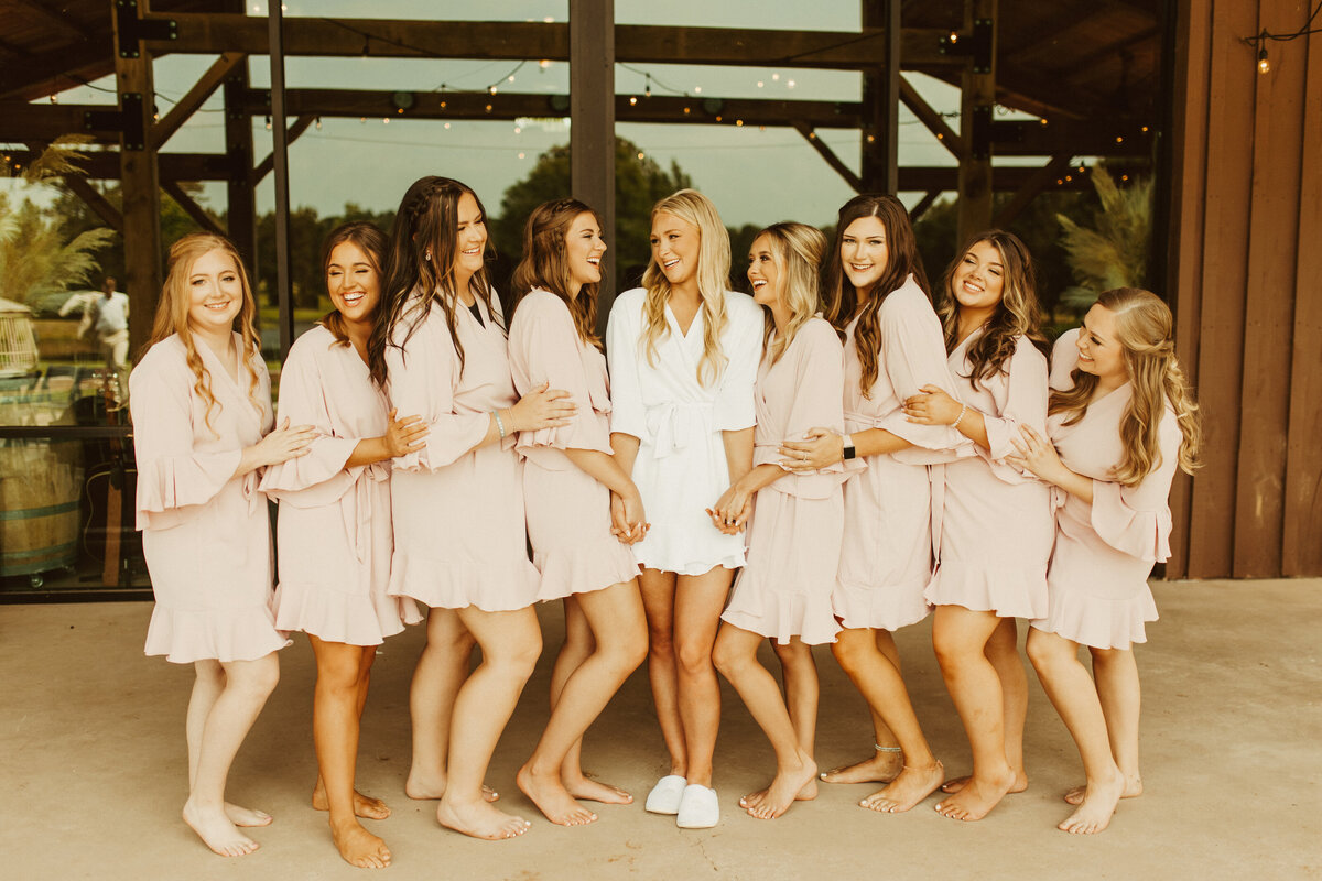 bride with bridal party in robes