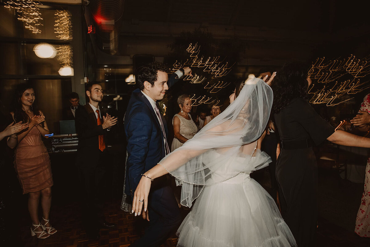 A wedding couple dancing at their reception 