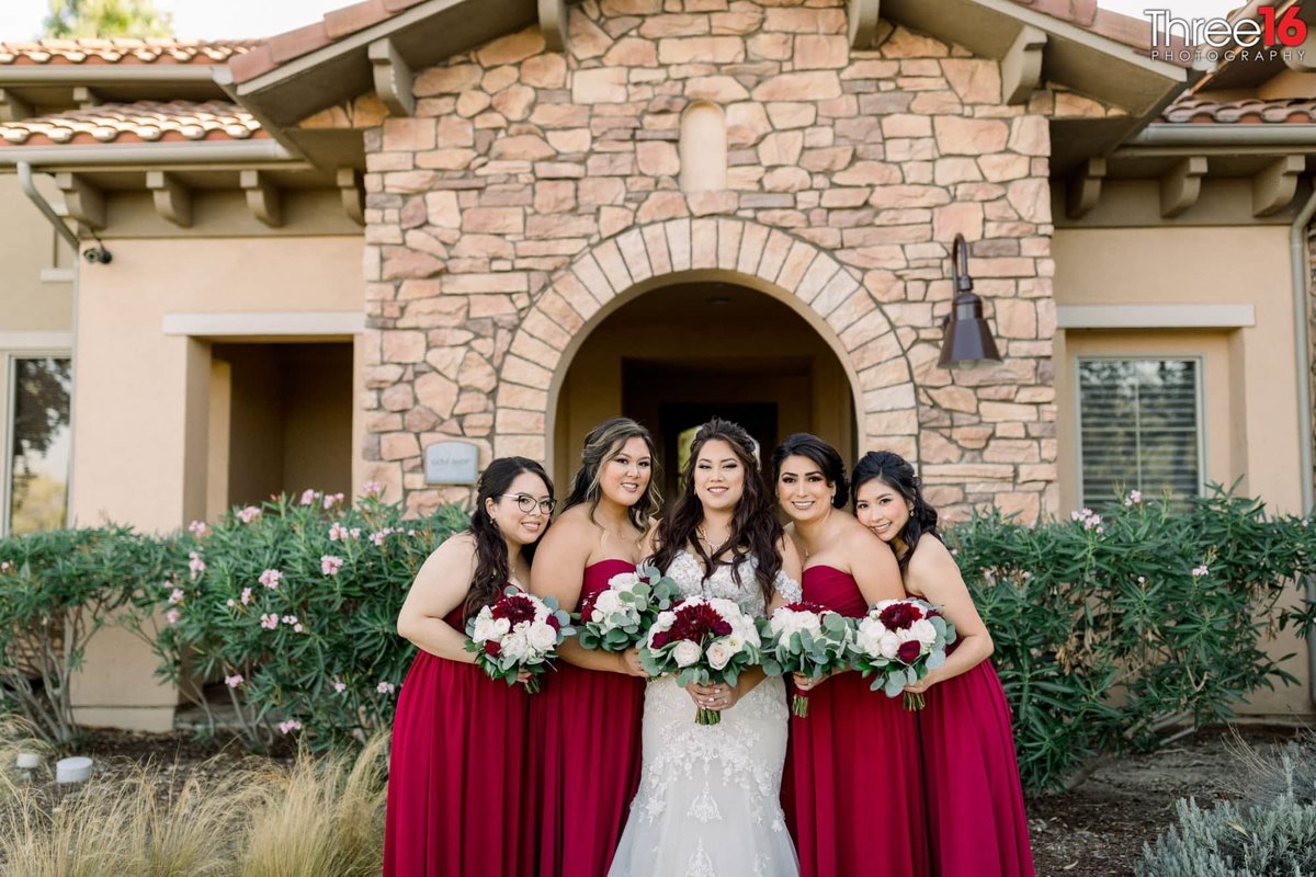 A Bride and her Bridesmaids posing together