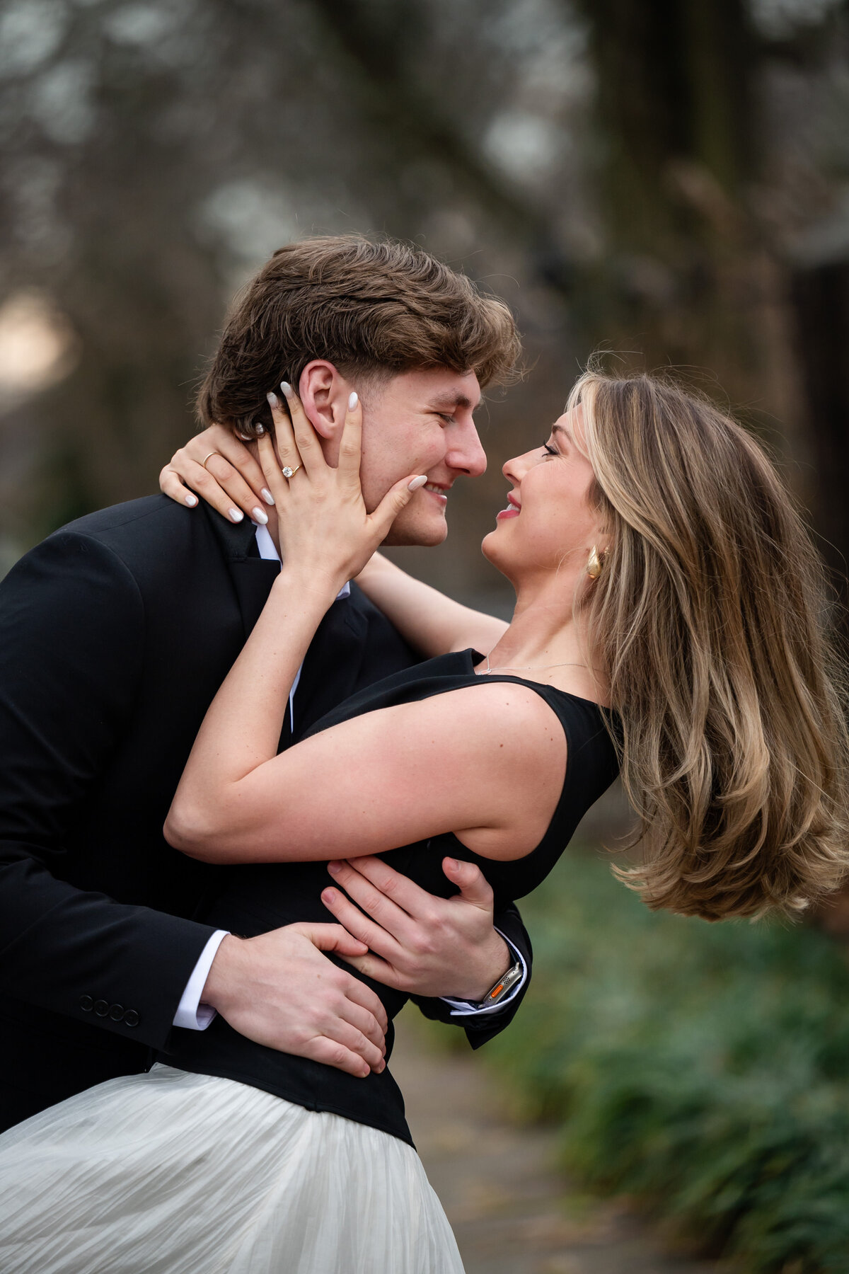 couple kissing at mellon park garden after marriage proposal
