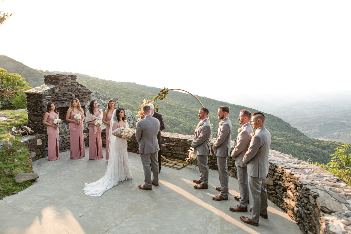 Wedding photo in West Jefferson, NC of a wedding ceremony on top of a mountain in the blue ridge mountains.