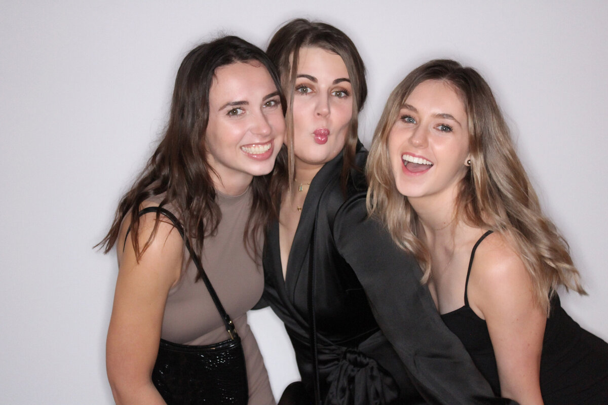 three-friends-posing-for-picture-with-vancouver-photo-booth-rental