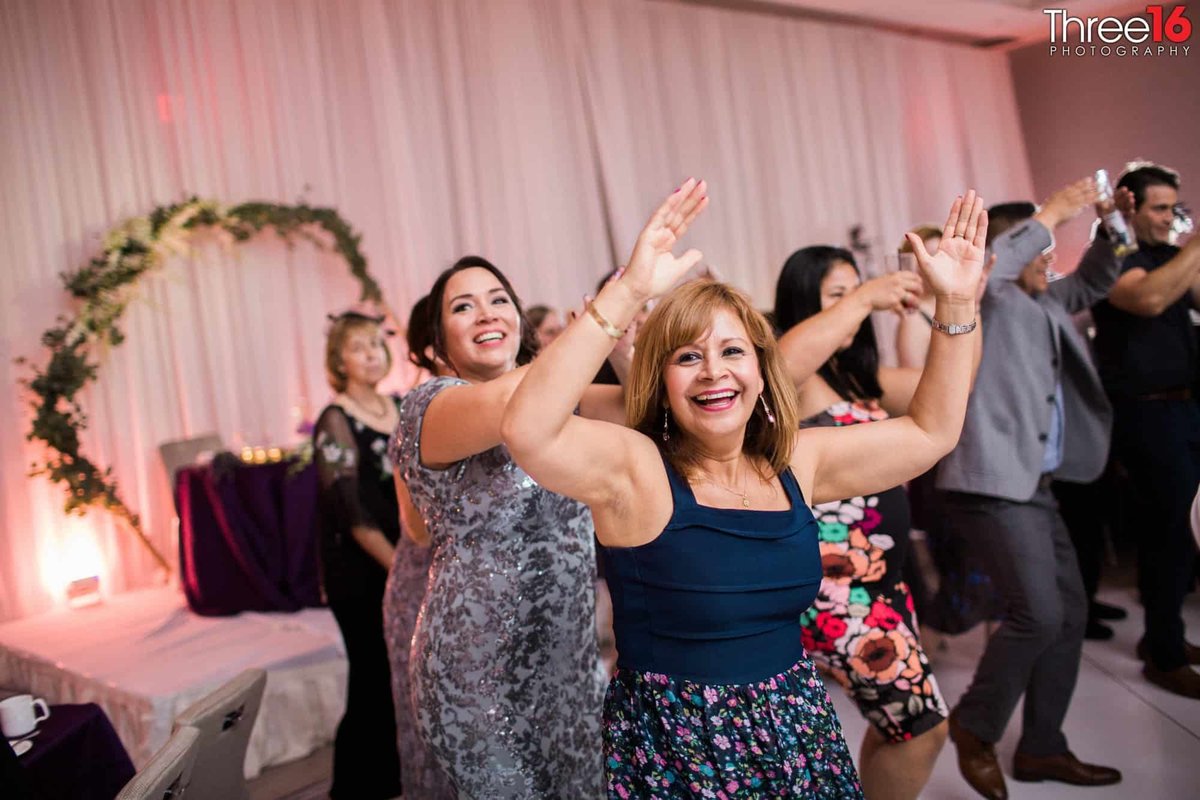 Women dancing at a wedding reception