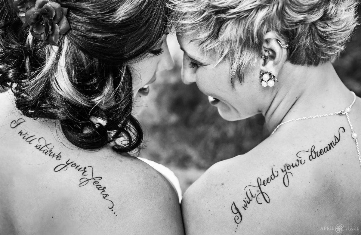 Romantic B&W Photo of two brides with coordinating tattoos  in Colorado