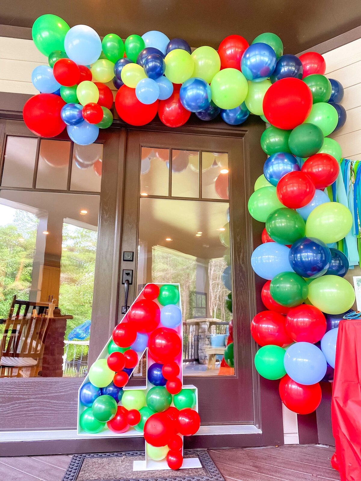 Huge number with balloons in it and balloon arch