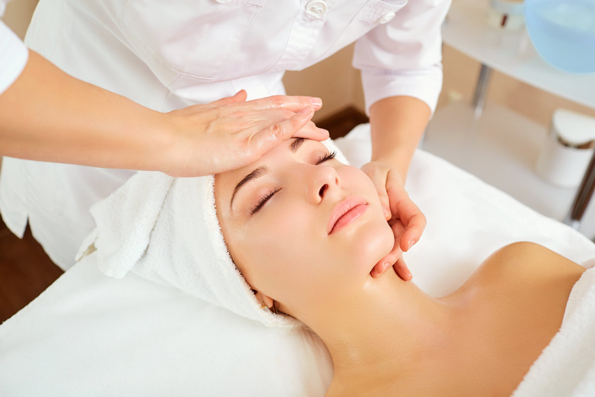 Relaxed woman receiving spa treatment
