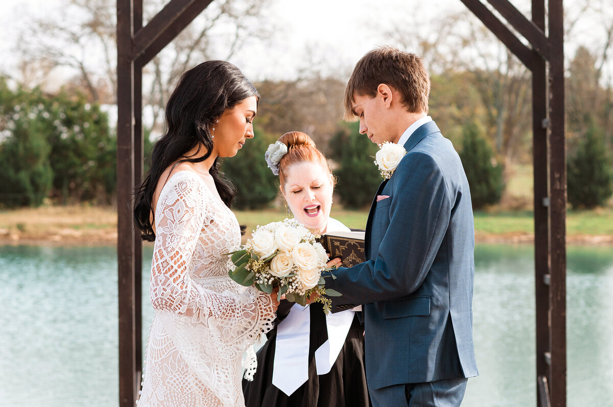 Couple exchanging rings and vows during their elopemenet