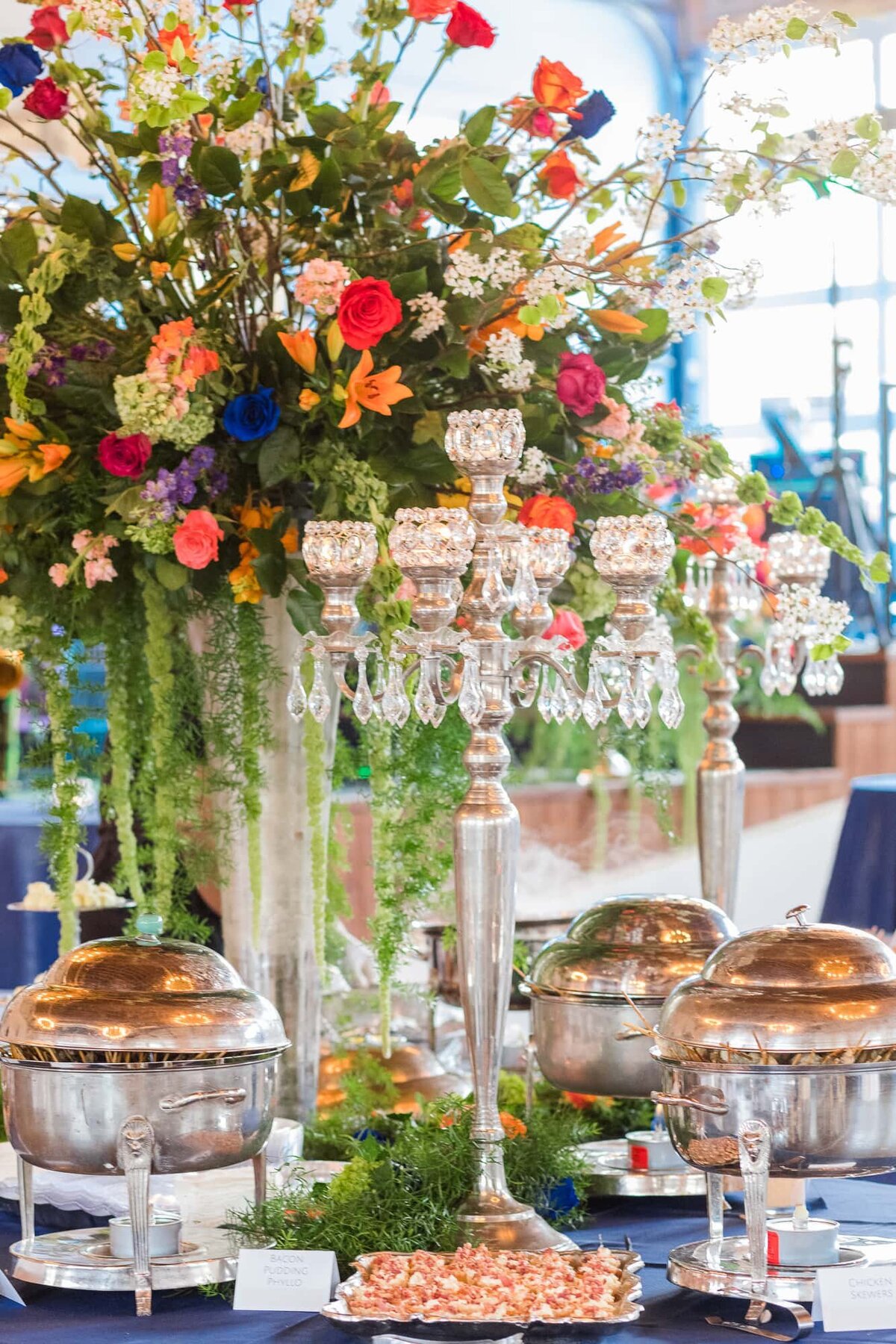 Wedding centerpiece with candelabra and tall florals