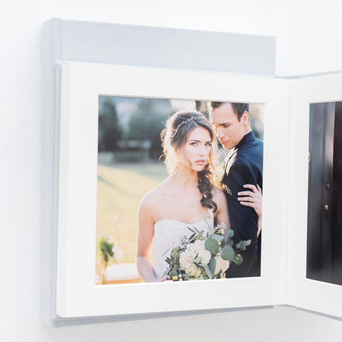 The inside of a matted album showing the thick white mat border and beautiful fine art prints inside by Washington DC Family Photographer