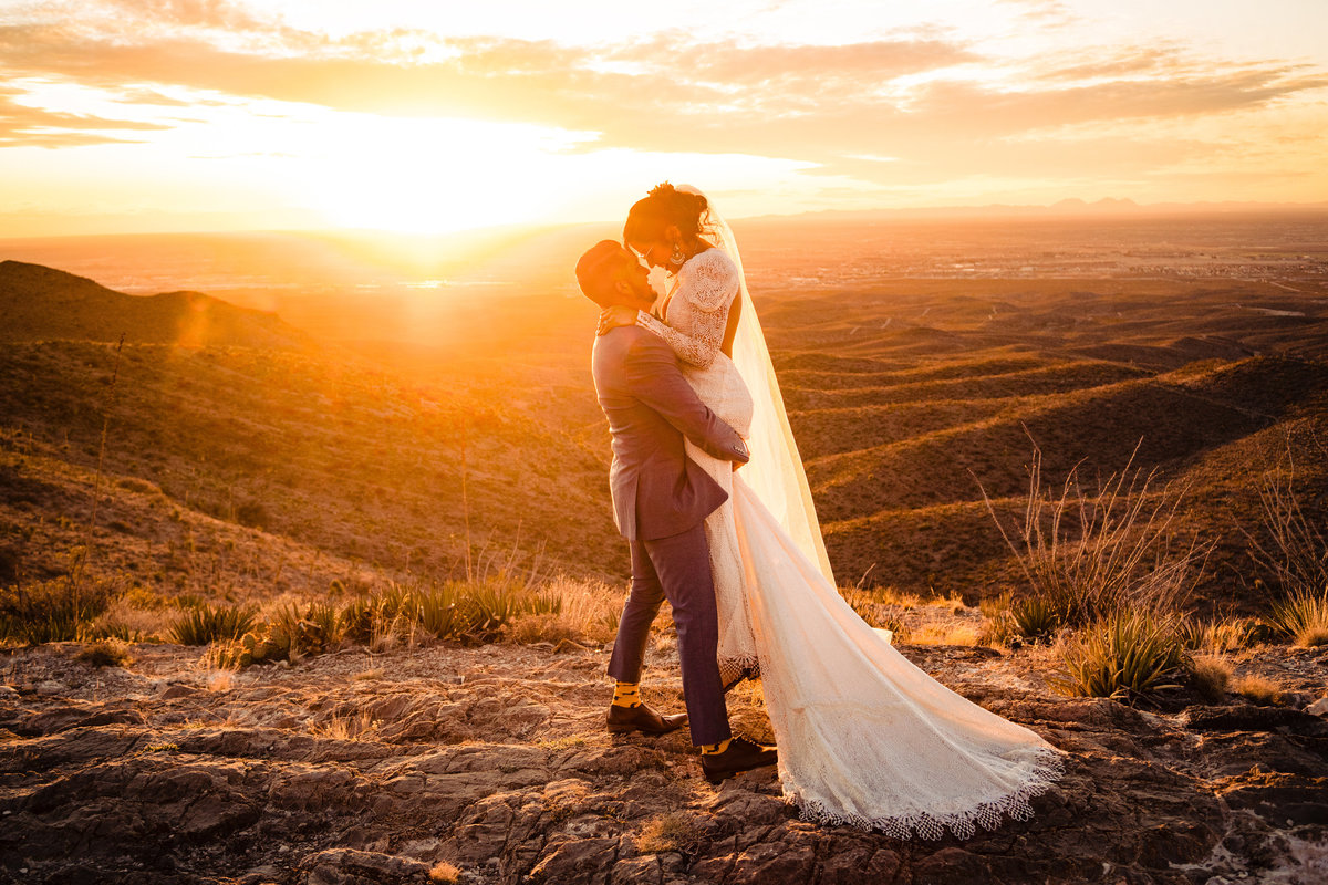 a bride and groom embrace at sunset in El Paso Texas