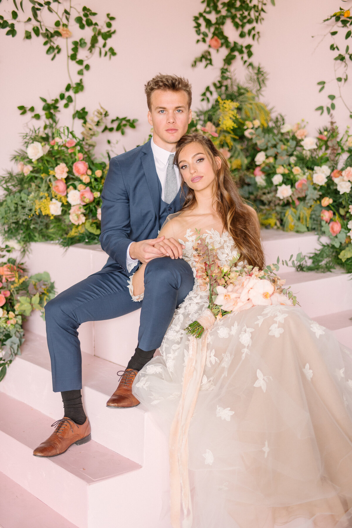 Bride and groom pose for a pink chic editorial styled shoot in Las Vegas, NV.