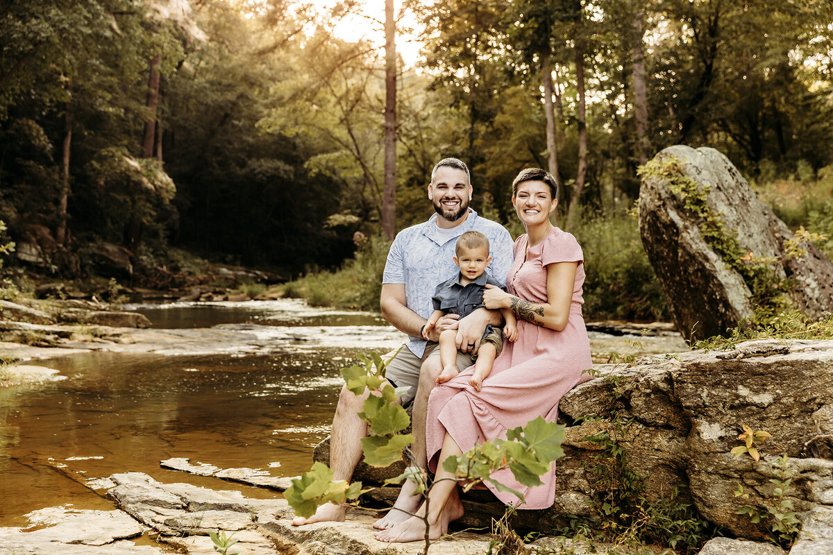 Family near creek for a mini session during golden hour.