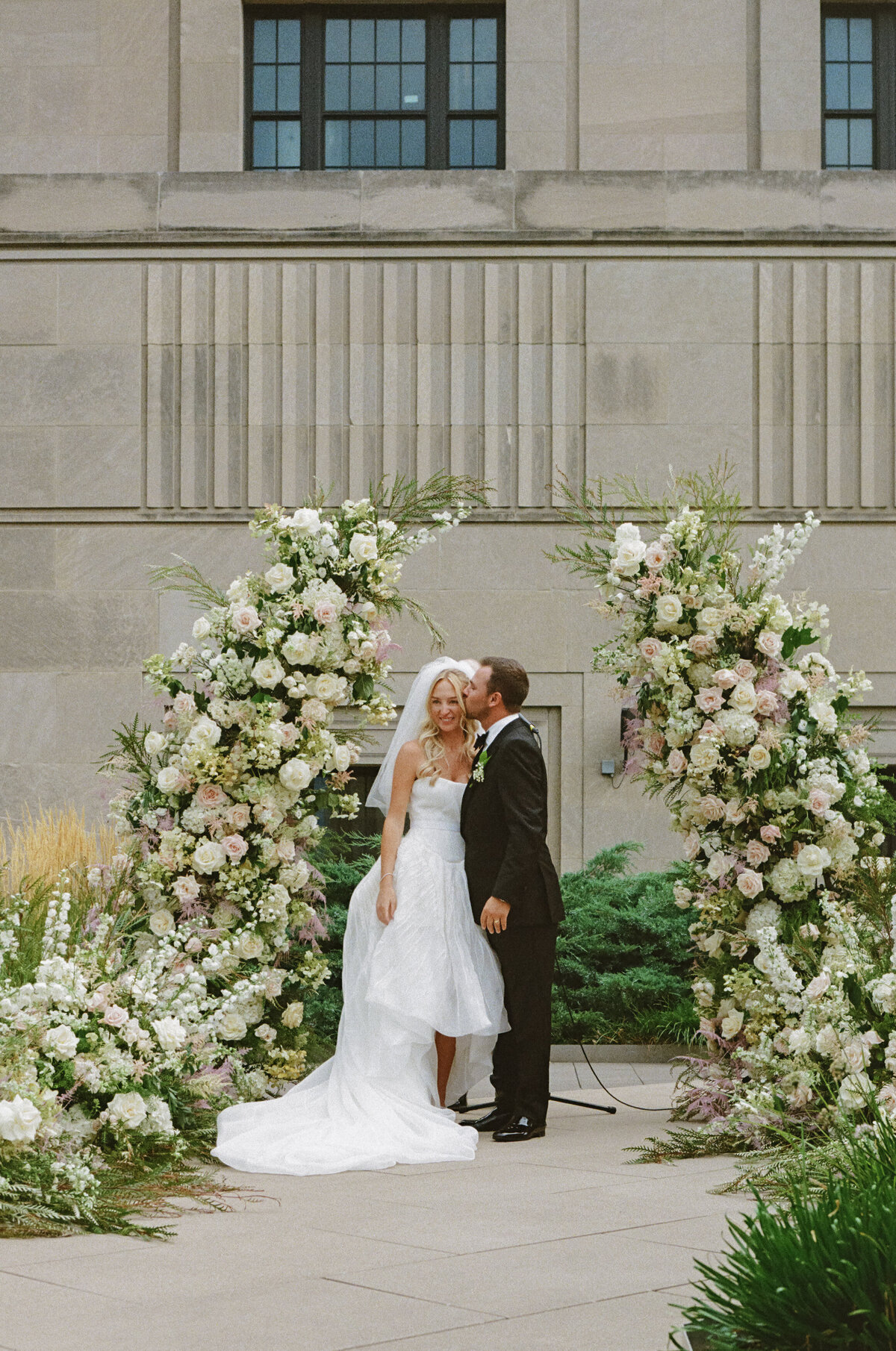 Film photography captures editorial ceremony elegance at Old Post Office Chicago with Lauren Alatriste's fashion forward approach, showcasing architectural beauty while maintaining sophisticated luxury wedding imagery and authentic emotional storytelling.