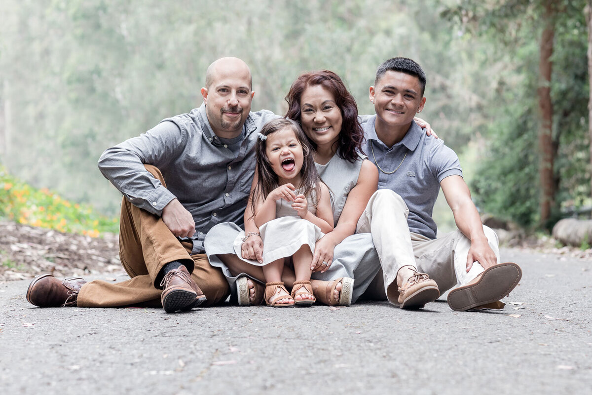 family sitting outdoors