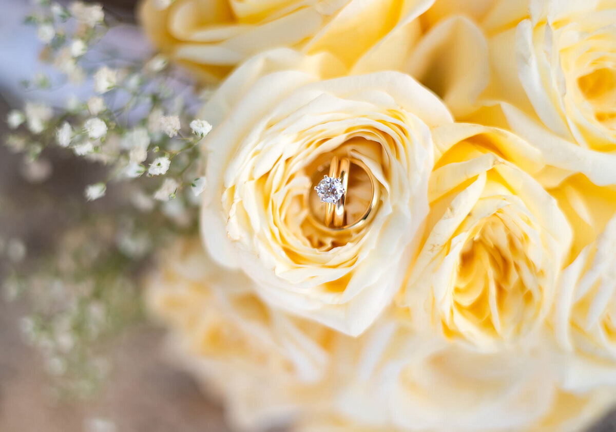 yellow roses bouquet and wedding ring