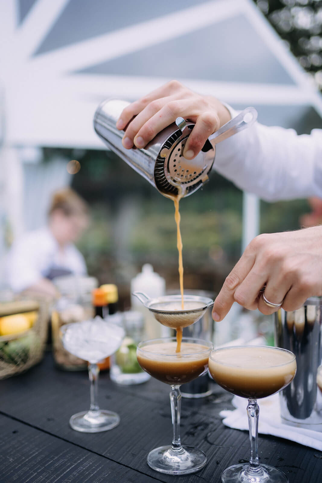 Bar person pouring drinks at wedding reception in Finger Lakes, NY