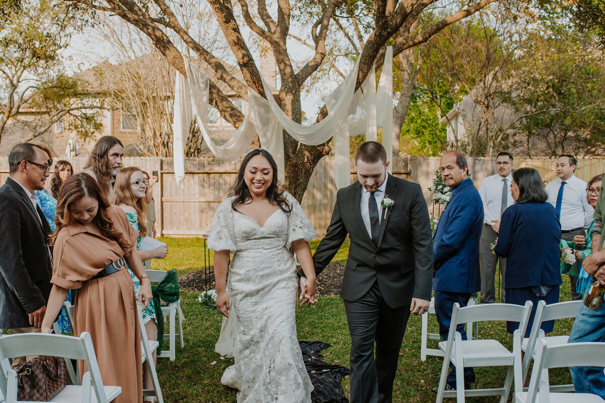 With the Houston skyline as a backdrop, I had the pleasure of photographing a couple's intimate backyard wedding, where the air was filled with laughter and love. From the rustic elegance of the outdoor setting to the heartfelt exchanges of vows, every moment captured the essence of their beautiful bond.