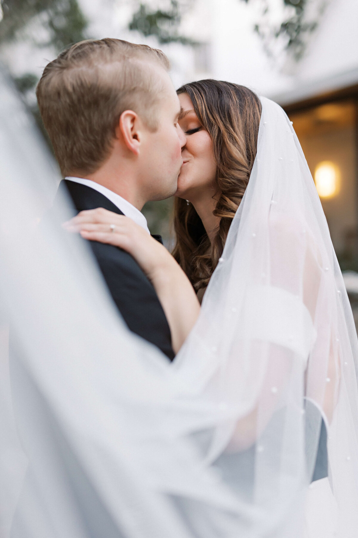 bride and groom portraits with veil