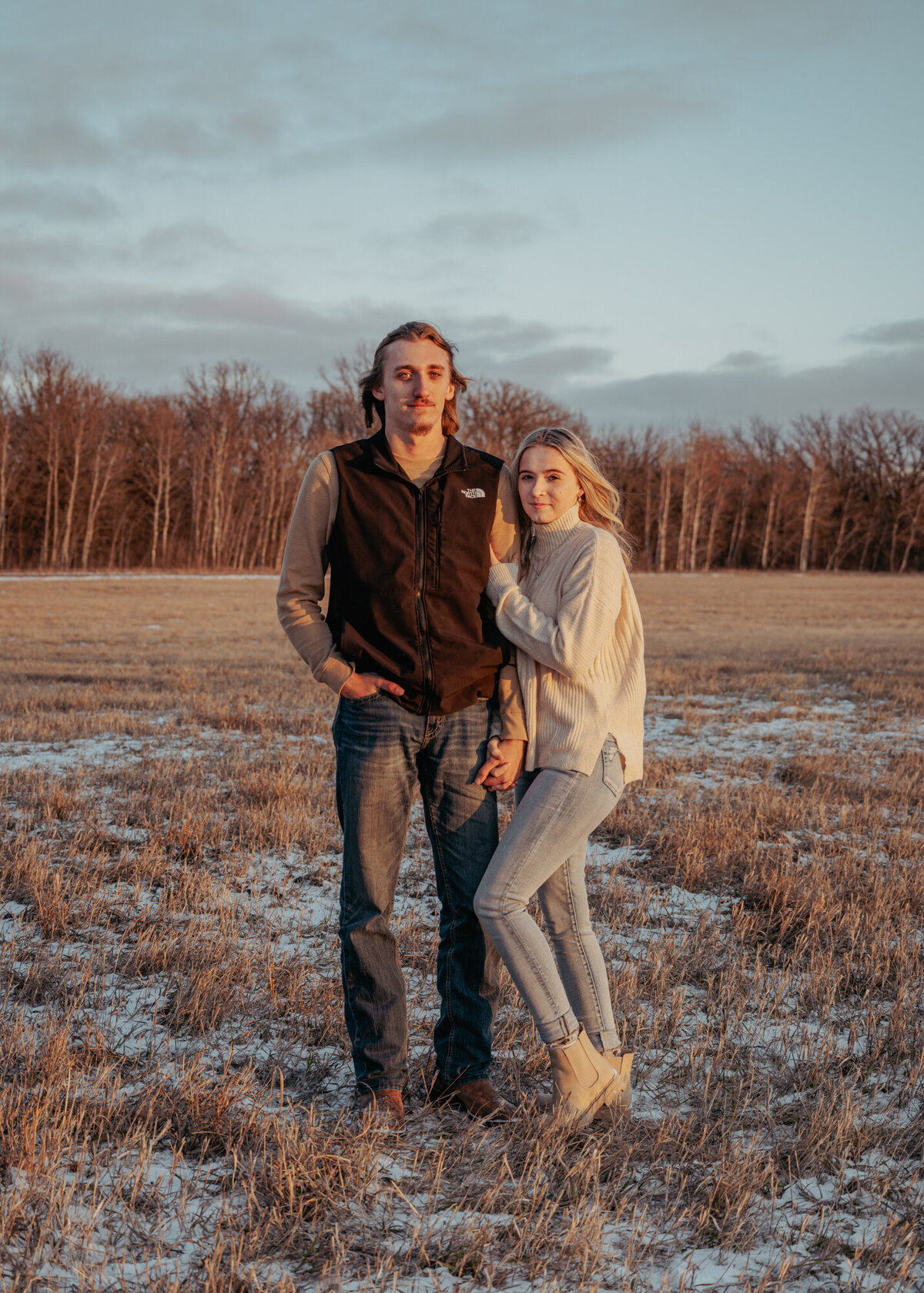 male and female looking at camera smiling