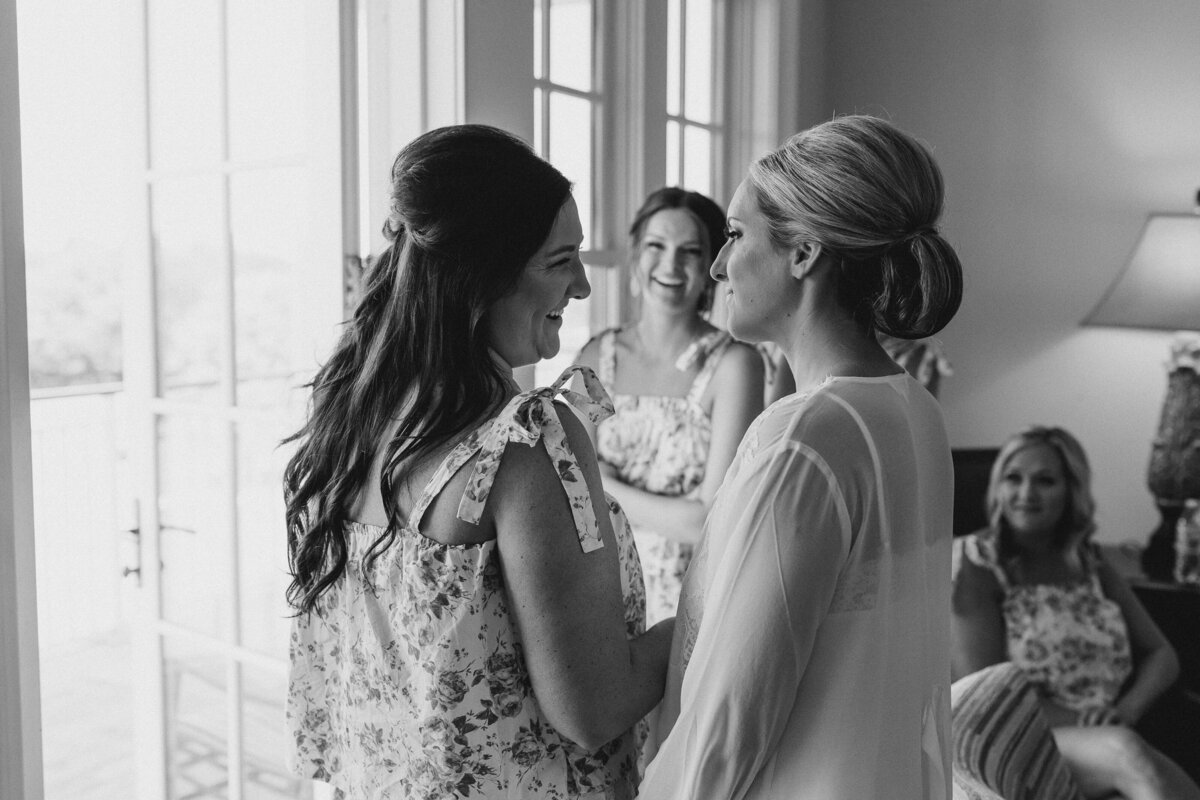 Bride getting ready with bridesmaids in black and white