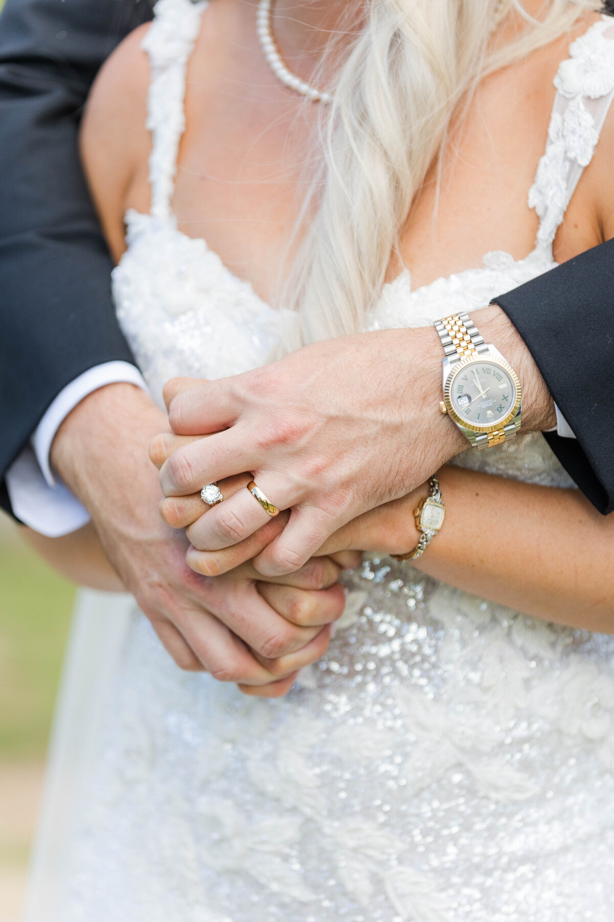 bride-and-groom-hands-interlocked