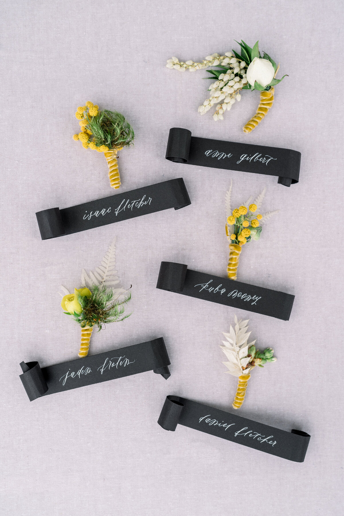 Black and yellow wedding boutonniere at Sunstone Winery wedding in Santa Ynez, CA