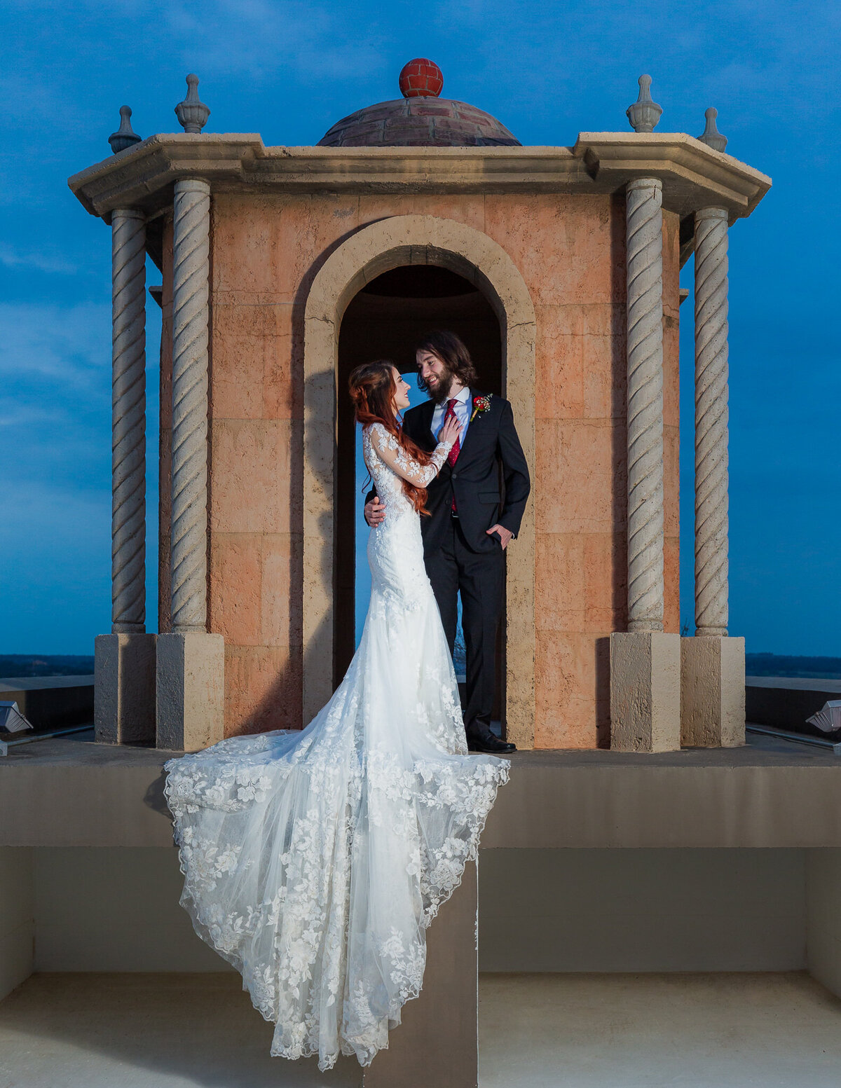 Dallas Wedding Photographer at night with bride and groom on rooftop