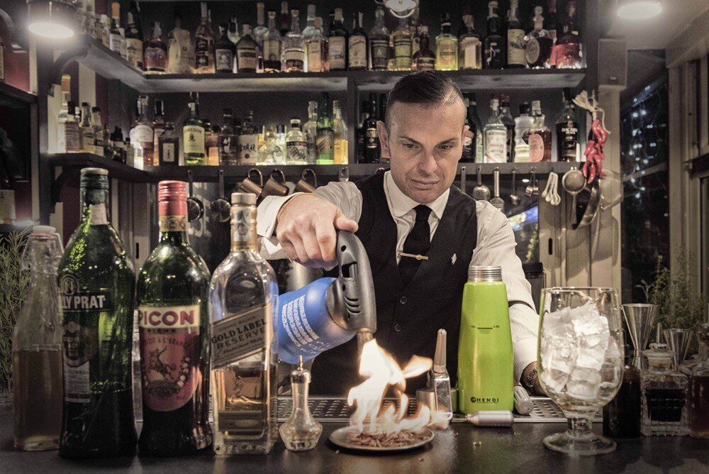 Italian Mixologist Matteo Zed makes cocktails at The Court terrace bar at Palazzo Manfredi in Rome 