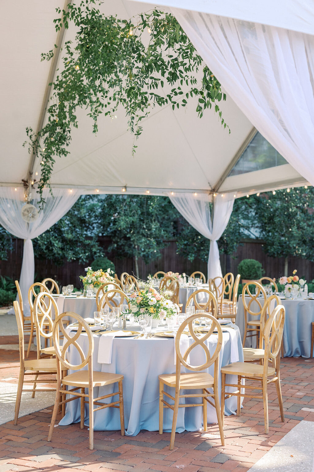 Outdoor Sailcloth tent wedding reception with elegant florals at 255 Milledge