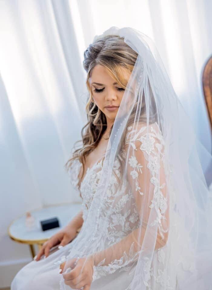 This dreamy bridal hair and makeup look features romantic soft waves and flawless lashes, created by our professional wedding hair and makeup team. Mistique Makeup provides on-location services across Austin, Dallas, and San Antonio to make your wedding morning stress-free and beautiful.